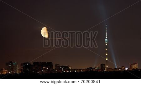 Half Moon Over Tv Tower And City In Summer Night