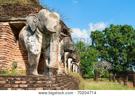 Elephants Statues On Ruins Of Buddhist Temple.