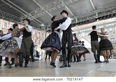 ZAGREB, CROATIA - JULY 19: Members of folk groups Nograd  from Salgotarjan, Hungary during the 48th International Folklore Festival in center of Zagreb, Croatia on July 19, 2014