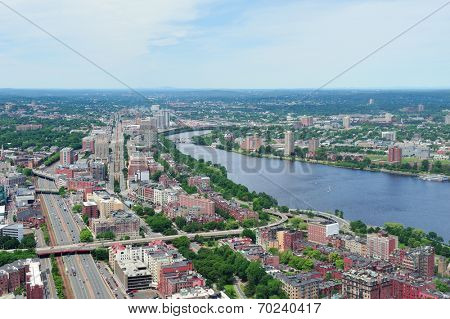 Boston city aerial view with urban buildings and highway with Charles River in Cambridge district.