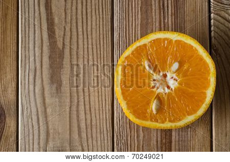 Cut Orange From Above On Wood