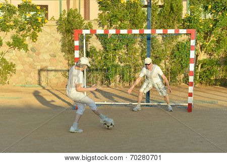 Active couple playng football