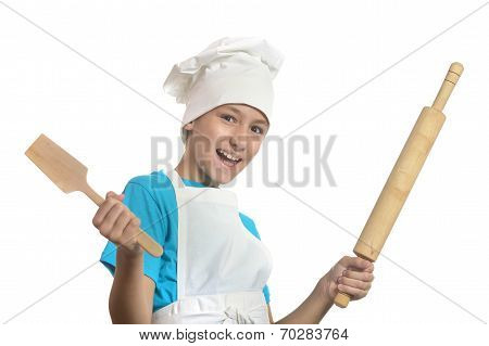 Kitchen boy holding battledore and spatula
