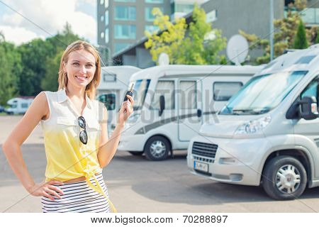Beautiful Young Woman Offers Campervans At Shop.