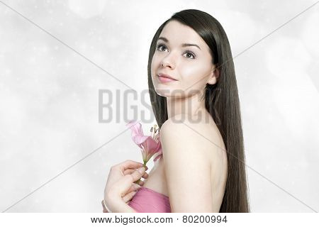 Beautiful Young Brunette Woman With Pink Lilly