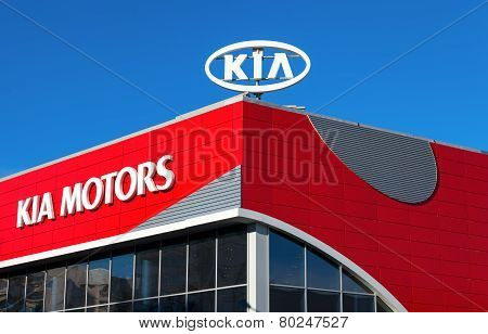 The Emblem Kia Motors On Blue Sky Background