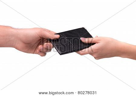 hand giving passport to other person