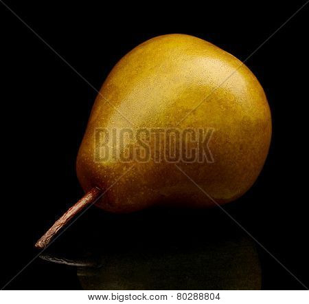 Single One Pear Called Manon Isolated On Black