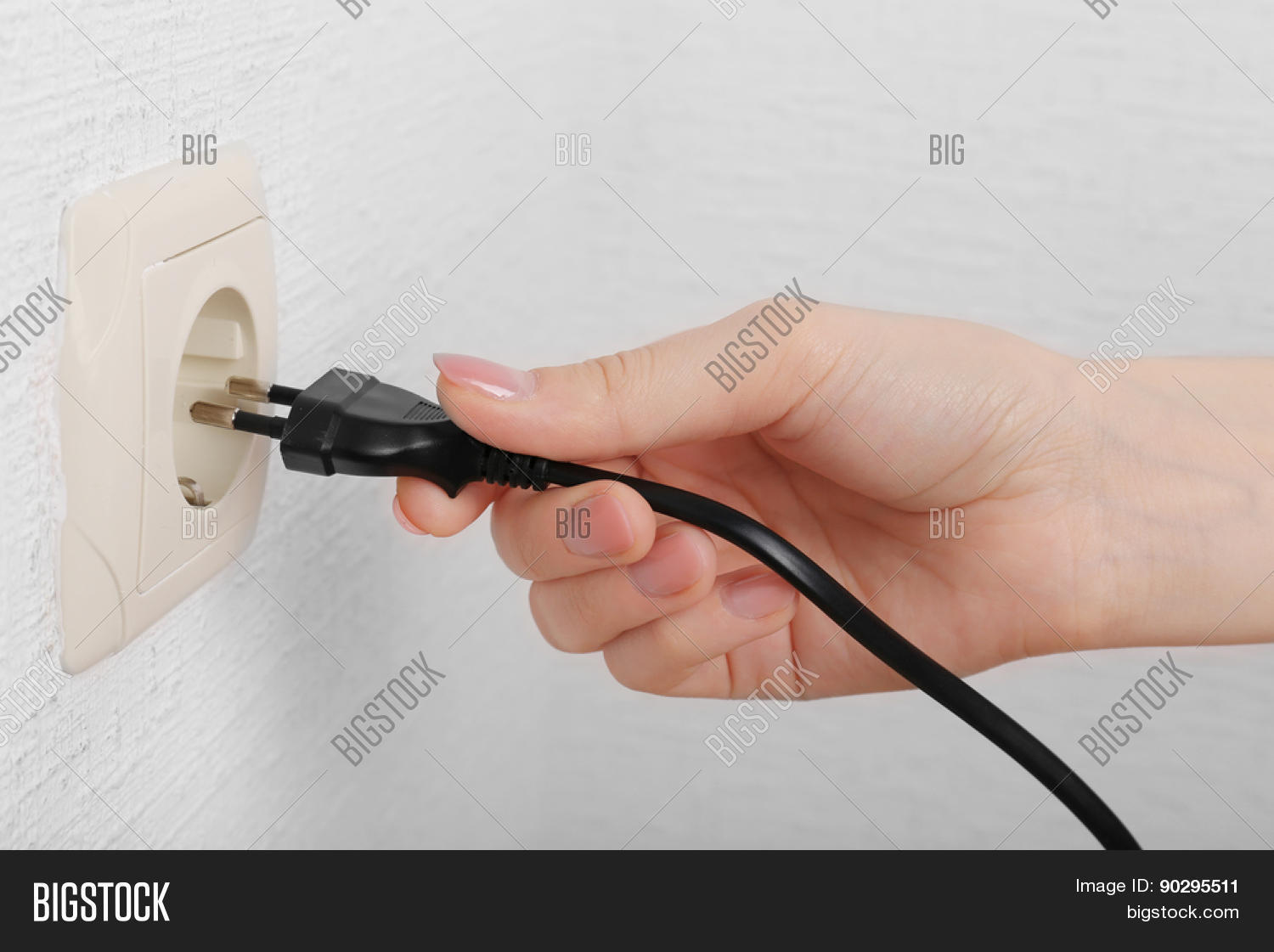 Putting plug. Искрит розетка. Kettle plugged into socket image. Putting plug. Put hands in the power socket.