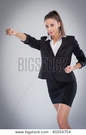 Powerful Business Woman Pulling A Punch