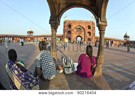 Group Of Worshipers Rest On Courtyard Of Jama Masjid Mosque In Delhi