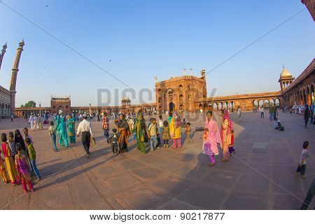 Group Of Worshipers Rest On Courtyard Of Jama Masjid Mosque In Delhi