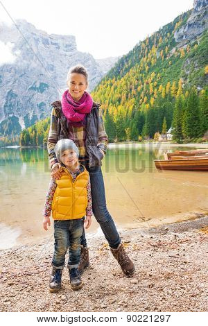 Mother And Daughter Together Smiling At Lake Bries