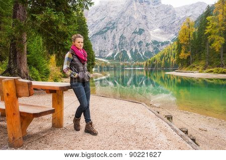 Woman Hiker Resting At Picnic Table On Lake Bries