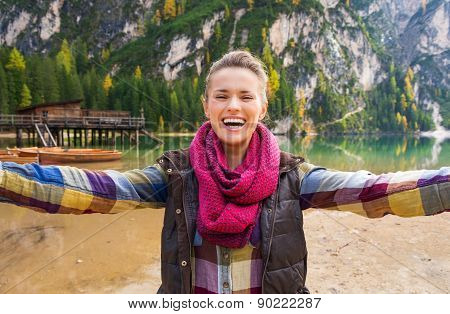 Laughing And Smiling Woman Taking Selfie On Lake Bries