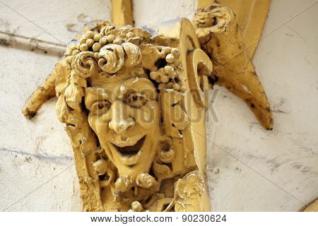 Drunken Bacchus. Stucco mascaron on the Art Nouveau building in Prague, Czech Republic.
