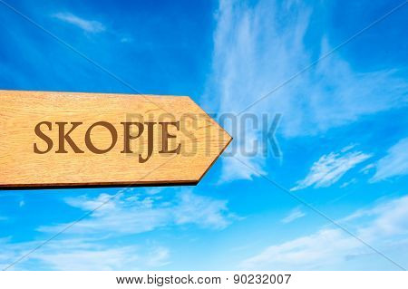 Wooden arrow sign pointing touristic destination