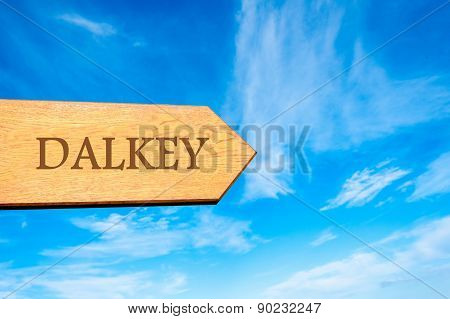 Wooden arrow sign pointing touristic destination