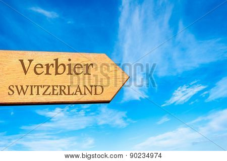 Wooden arrow sign pointing touristic destination