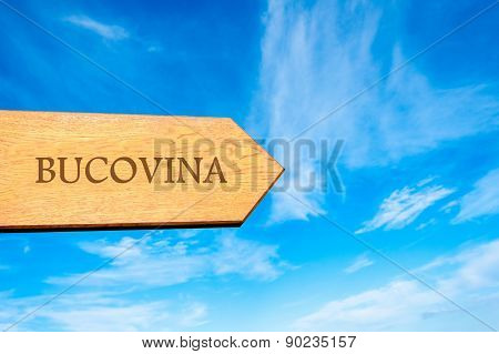 Wooden arrow sign pointing touristic destination