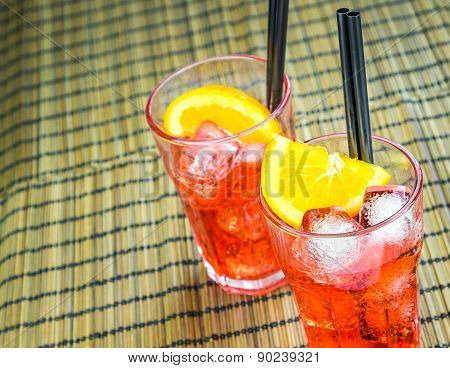Top Of View Of Spritz Aperitif Aperol Cocktail With Two Orange Slices And Ice Cubes