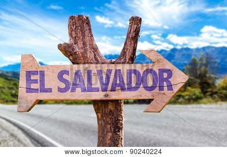 El Salvador wooden sign with road background