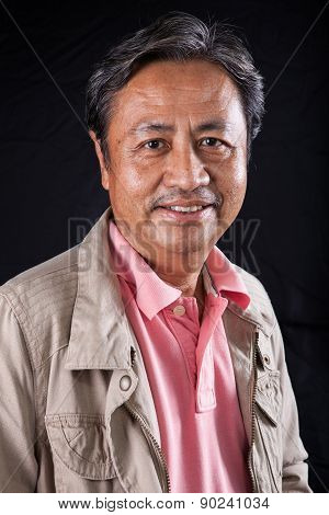 Portrait Close Up Smiling Happiness Face Of 59S Years Old Asian Man With Studio Light Against Black