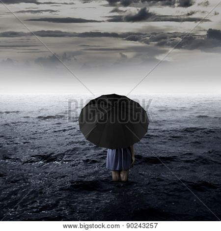 Backview Of Woman Alone At The Sea