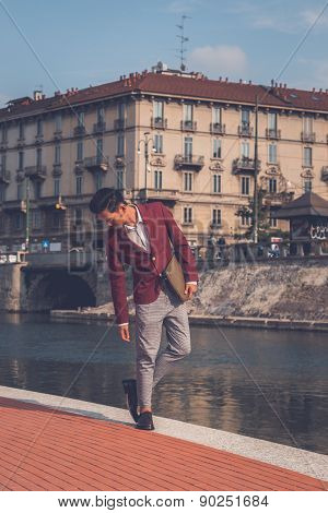 Handsome Asian Model Posing By An Artificial Basin