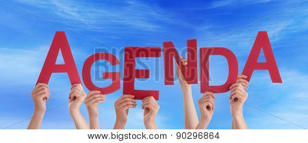 Many People Hands Holding Red Word Agenda Blue Sky