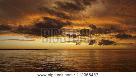 Multicolored Golden Sunrise Over Water.