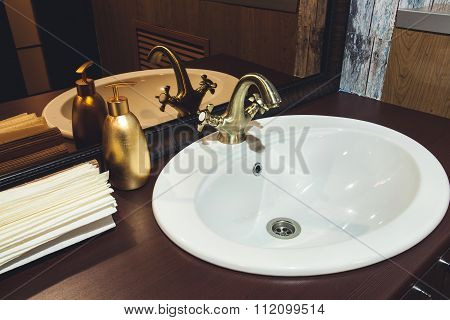 bronze faucet in the bathroom washstand