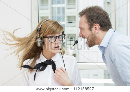 Boss yelling at his female assistant