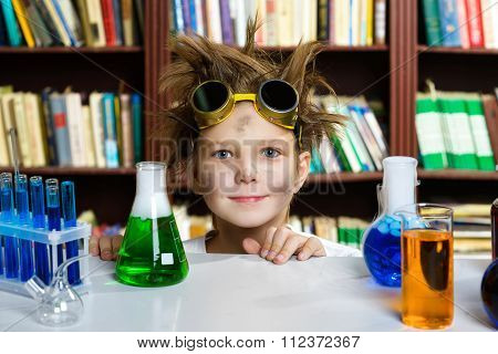Cute boy doing biochemistry research in chemistry class