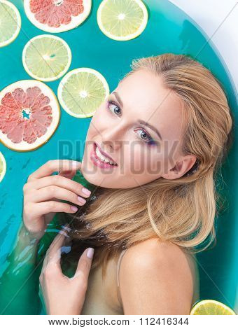 Beautiful Woman With Shiny Skin In Blue Water