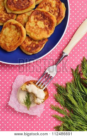 fresh potato fritter on a bright background