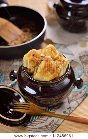 Fried Dumplings With Potatoes And Onions