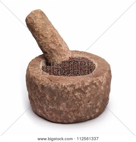 Organic brown mustard in mortar.