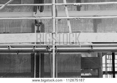 A Construction Site With Concrete Slabs Built Held Together With Scaffolding