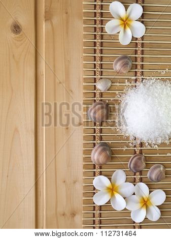 Shells And Tiare Flowers On The Wooden Background