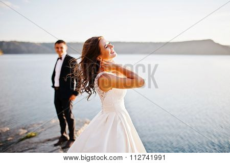 Very Sensual And Gorgeus Wedding Couple On The Picturesque Landscapes On Sunset