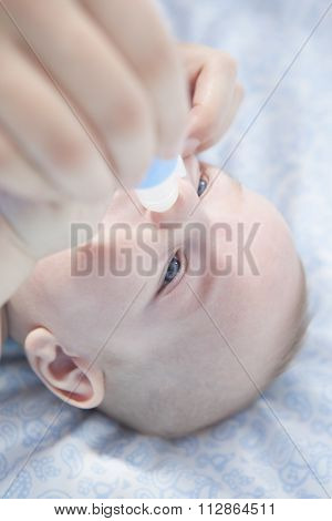 Mother Using Baby Nasal Aspirator