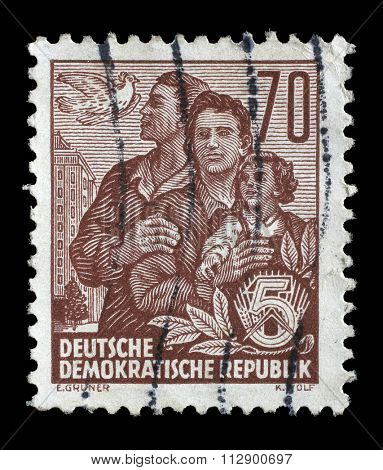 GDR - CIRCA 1955: A stamp printed in GDR, shows a family, series Five-year plan, circa 1955