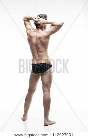 Handsome Muscular Bodybuilder Posing On White Background. Isolated Studio Shot