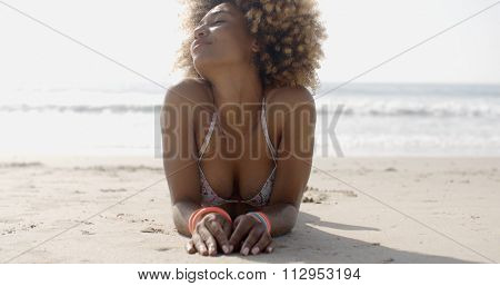 Portrait of woman in swim suit relaxing on tropical beach in slow motion