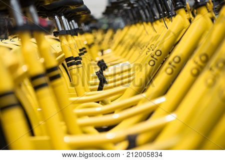 Chengdu, China - June 21, 2017 : Rows of yellow OFO station-free shared bikes