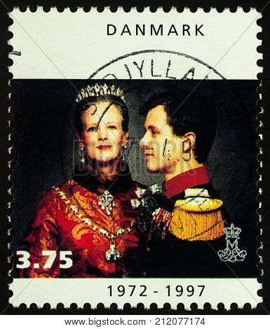 Moscow Russia - November 03 2017: A stamp printed in Denmark shows portrait of Danish Queen Margrethe II with Crown Prince Frederik series 