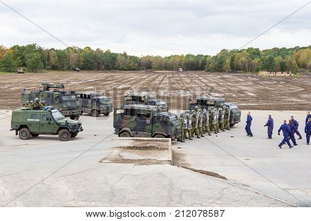 MUNSTER / GERMANY - OCTOBER 9 2017: german military police soldiers defends an area against role playing demonstrators