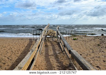 Boardwalk to the beach damaged by hurricane Irma striking on the east coast of Florida, USA.