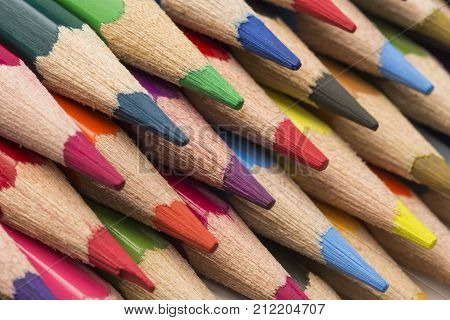 Colored pencils of various colors, close up